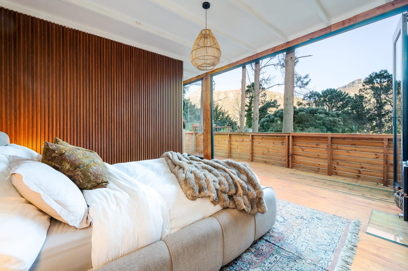 The bed looking out past the timber balustrade to the Hout Bay ridge