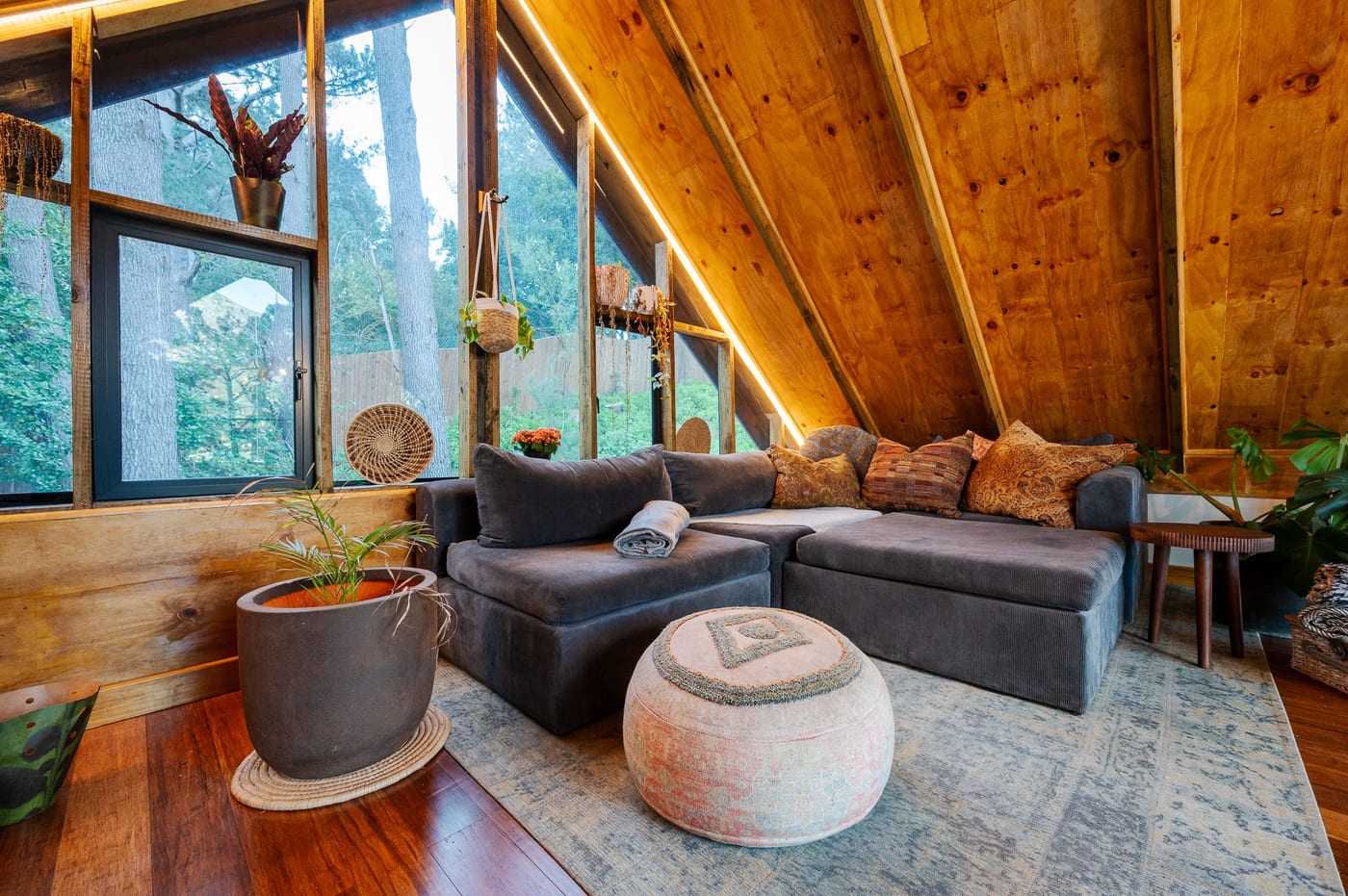 The corner sofa in the loft beneath the timber rafters